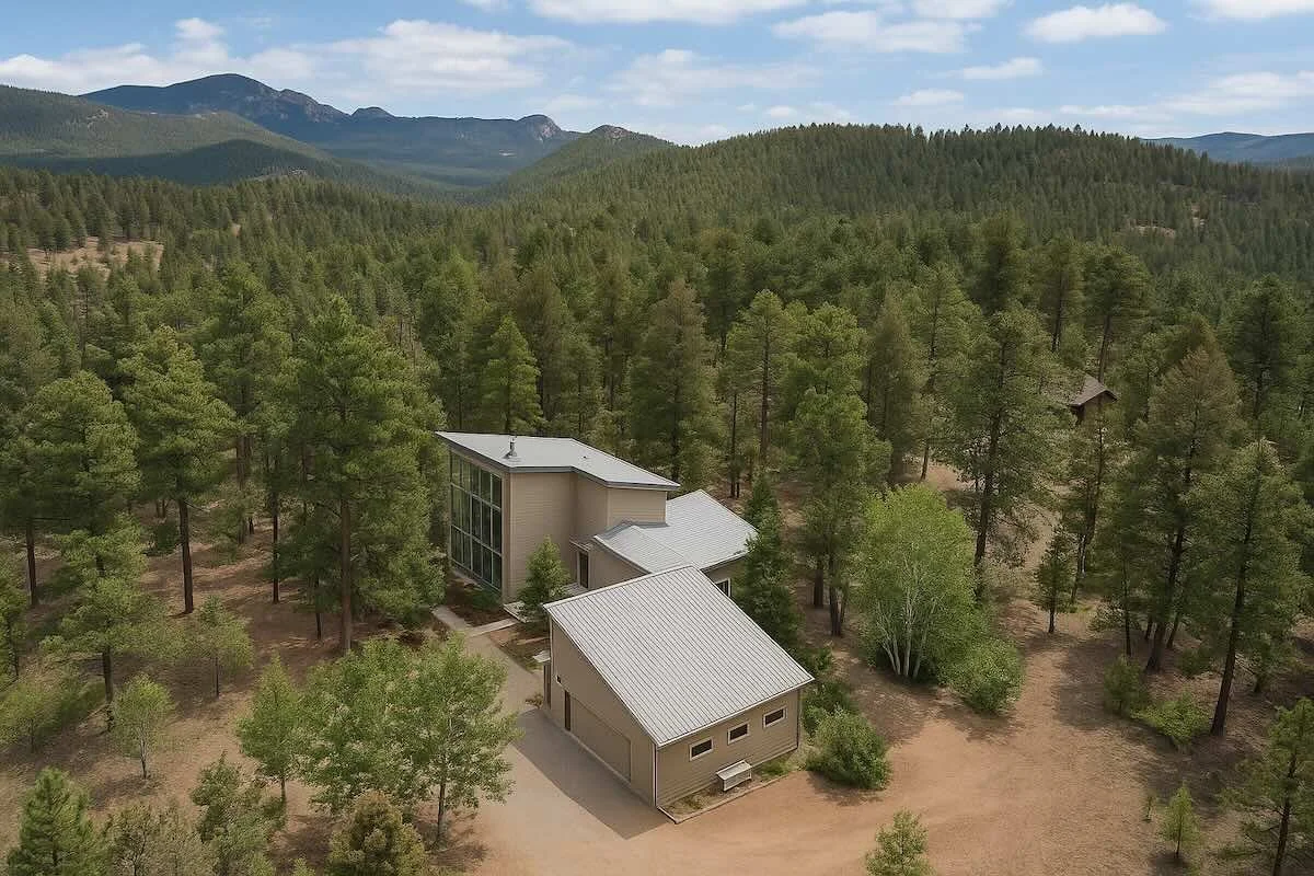 Stillwood Retreat surrounded by pine trees in the Colorado mountains