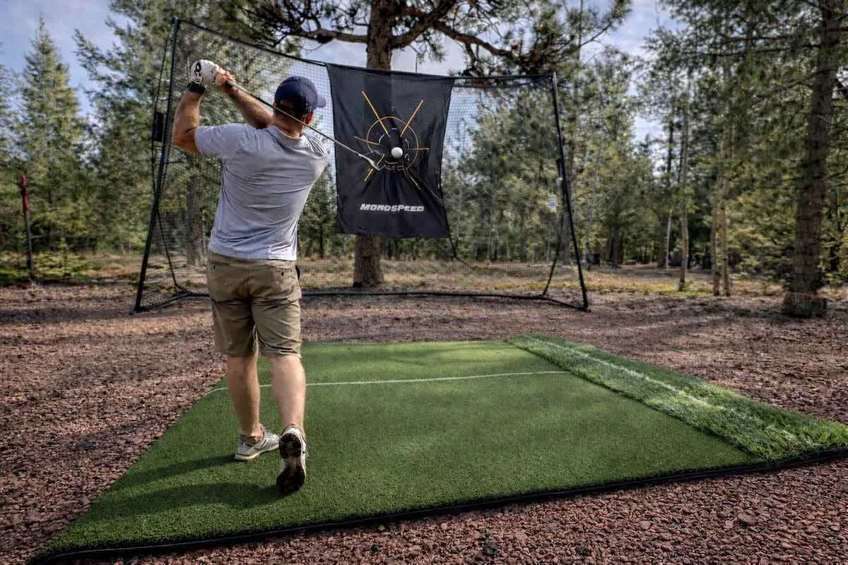 Golf hitting net and turf pad on the property