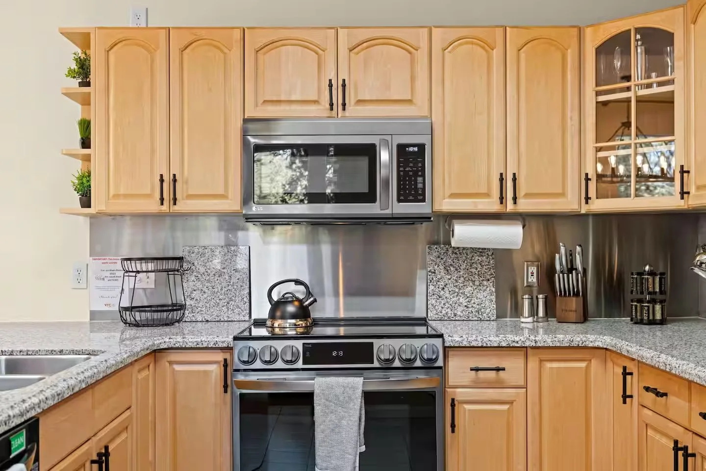 Kitchen counter with kettle, knife set and spices