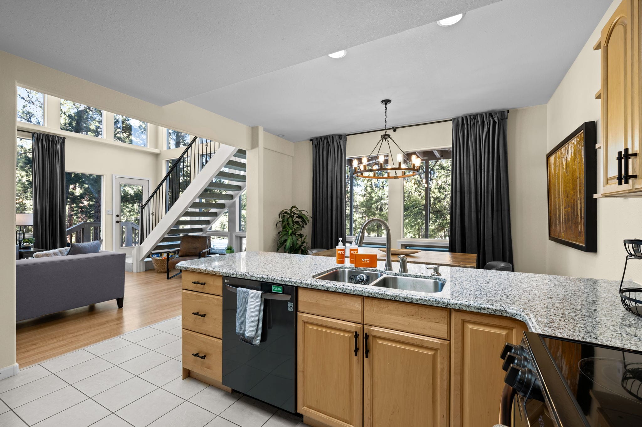 Wide view of the kitchen, counters and adjoining dining space