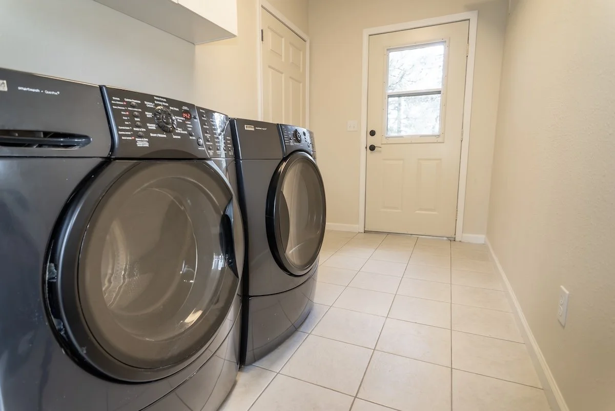 Laundry room with front-loading washer and dryer