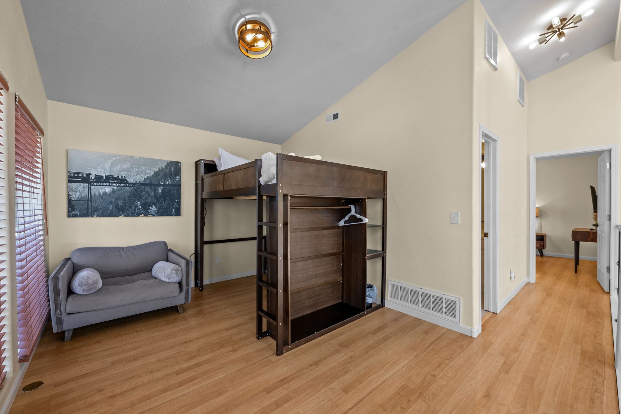 Loft with queen bed, seating and dedicated workspace