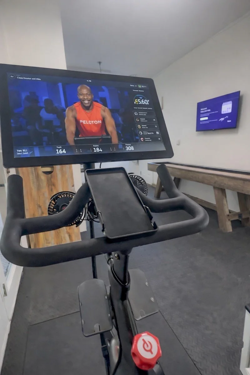 Peloton bike with a class playing on its screen