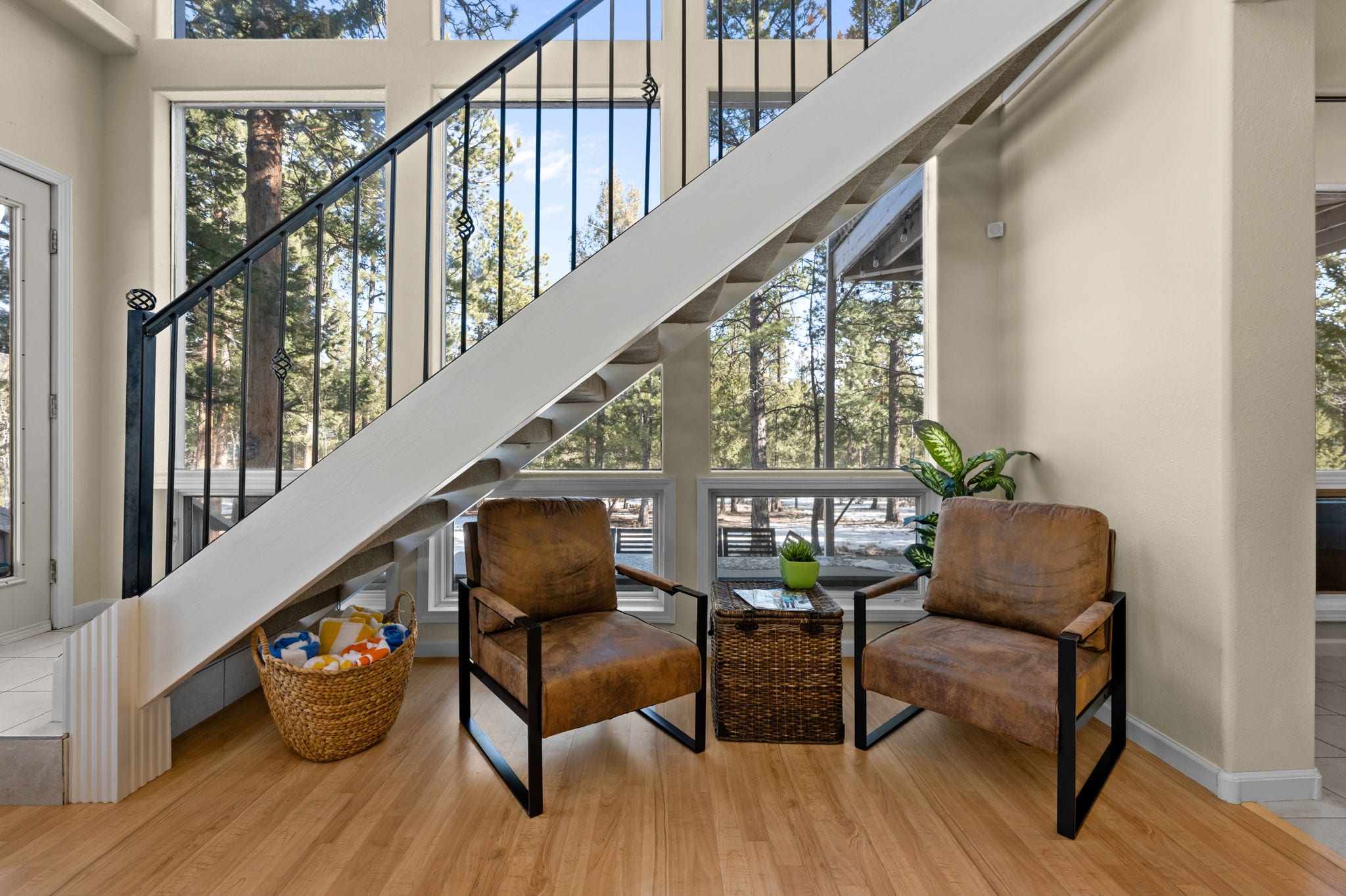 Quiet sitting area with comfortable chairs and forest views